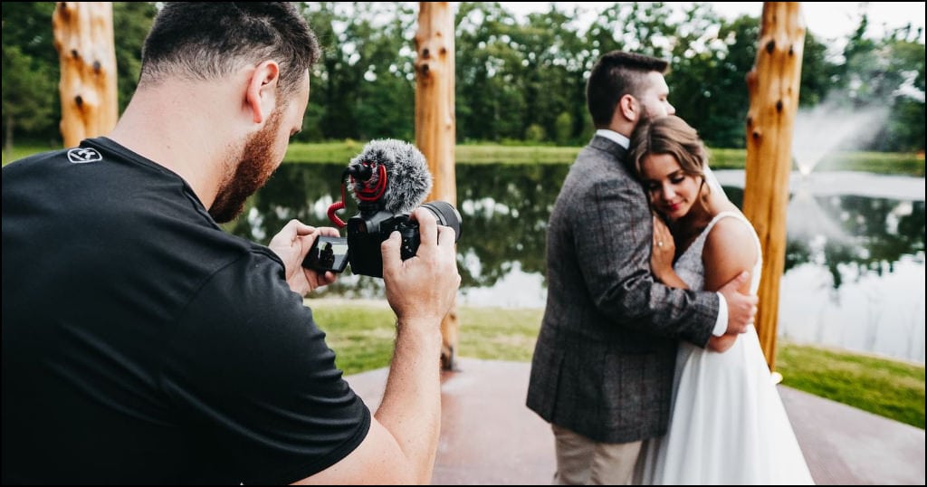 wedding cinematographer recording special moments with bride and groom.