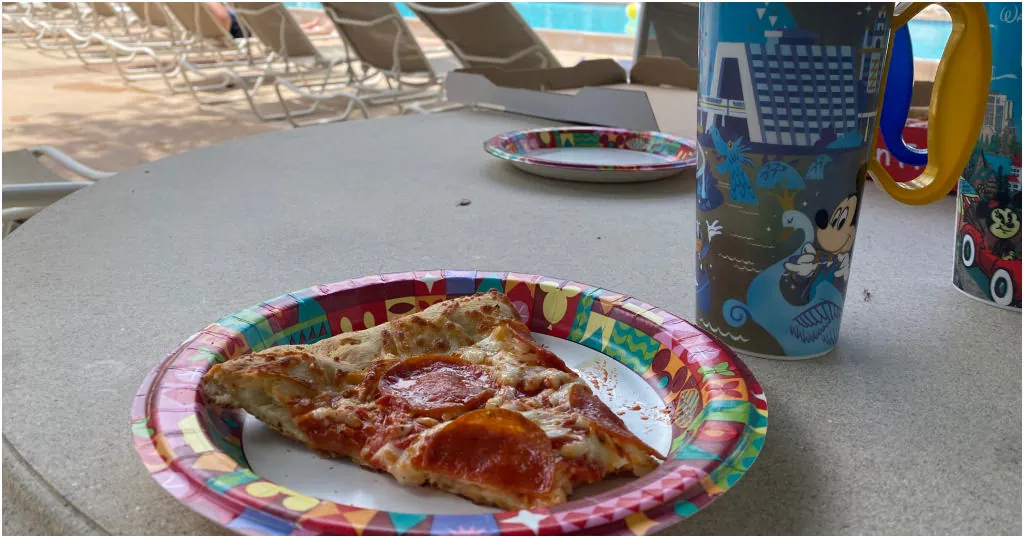 slice of pepperoni pizza and refillable mugs