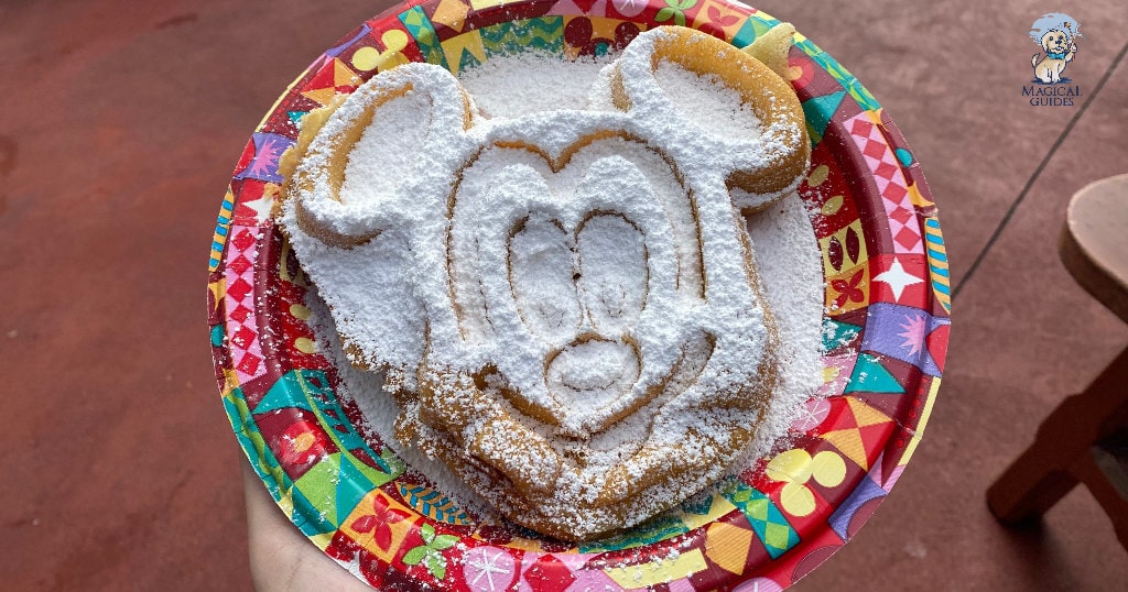 Powdered sugar covers huge mickey waffle.