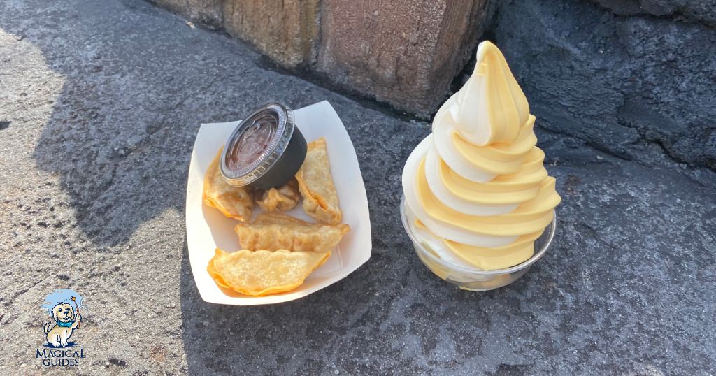 Pot Stickers with orange sauce along with orange dole whip swirled with vanilla ice cream