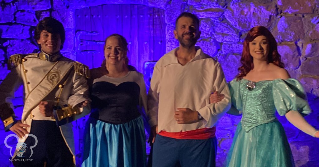 My husband and I standing with Ariel and Prince Eric during Mickey's Not So Scary Halloween Party.