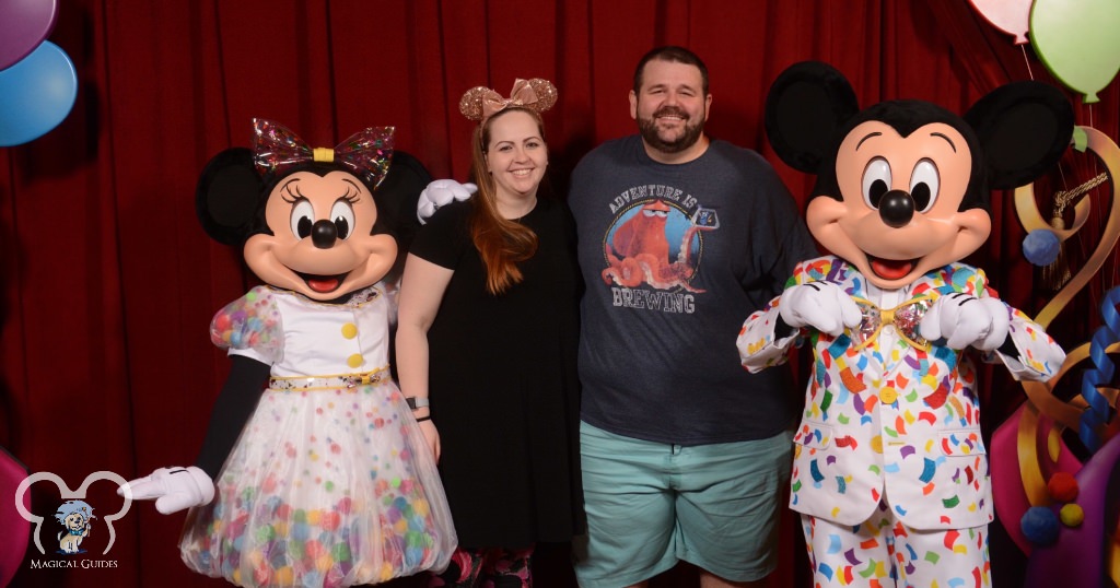 Meeting Mickey and Minnie during their 90th birthday celebration, showing off their birthday suits.