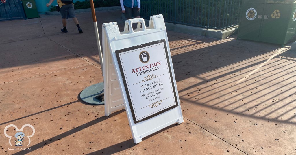 Signs outside of the entrance to Skyliner, saying it's closed.