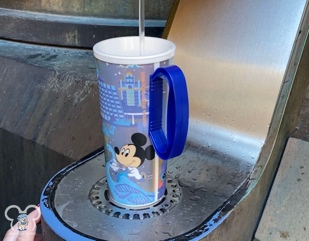 Filling up my resort mug with at a hydration station in Galaxy's Edge in Hollywood Studios