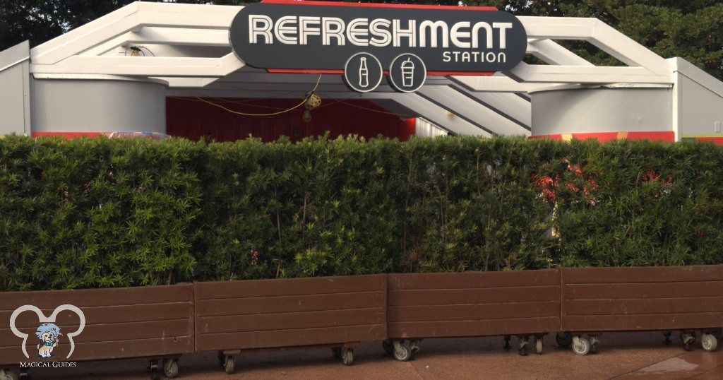 Bushes and planters block refurbishment of the Refreshment Station in EPCOT