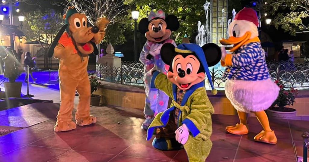 Mickey, Minnie, Donald and Pluto in their pajamas at Midnight Magic.