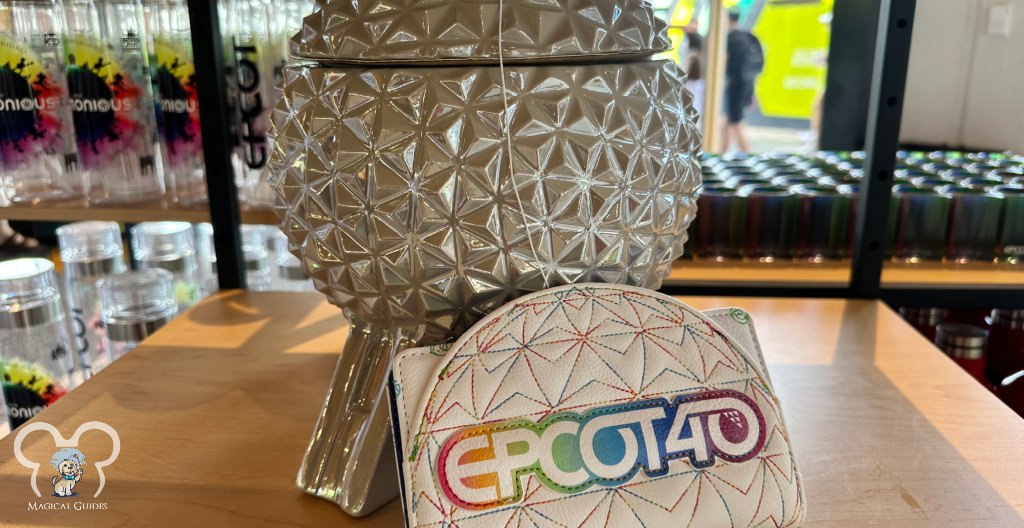 EPCOT 40 anniversary wallet paired with the Spaceship Earth cookie jar at Creations
