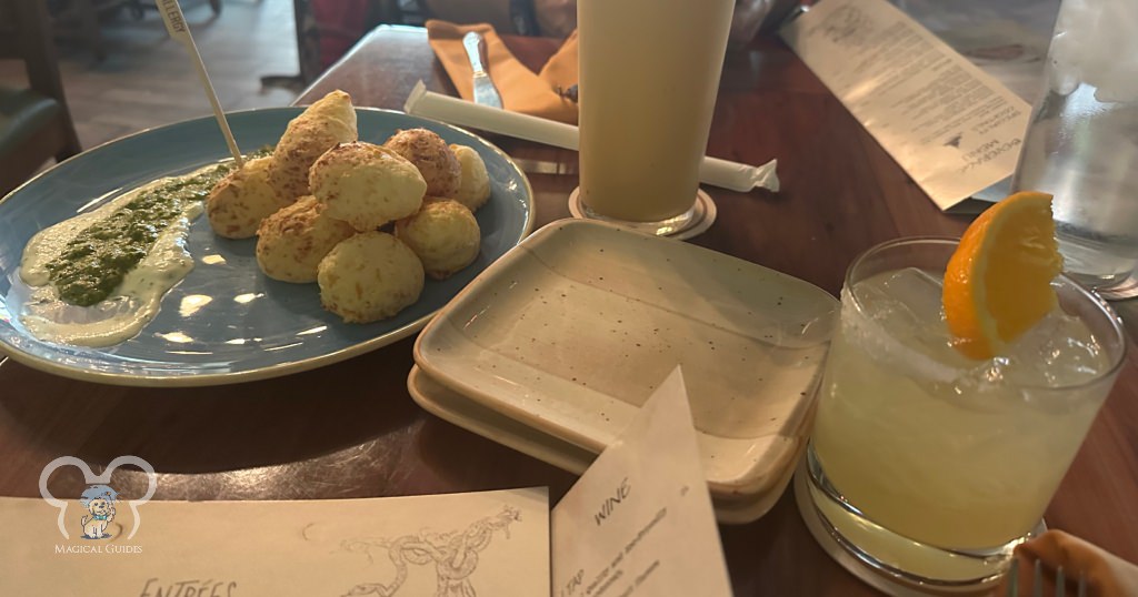 Magic Kingdom's Skipper Canteen featuring their Golden Haze Margarita and "Secret Menu Item" Pao de Queijo Appetizer. 