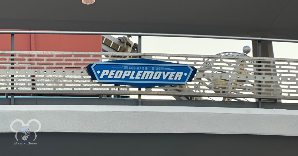 PeopleMover Sign in Magic Kingdom. You can see the Astro Orbiter in the background.