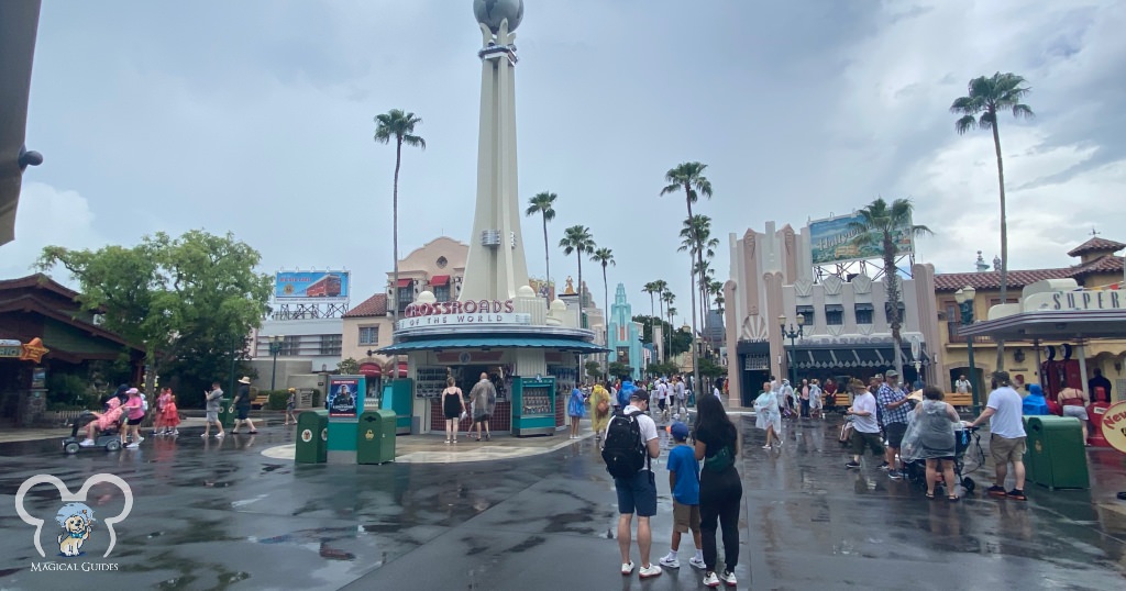 Rainy Day at the front of Hollywood Studios. You can see guests wearing ponchos and carrying umbrellas during this rainstorm.