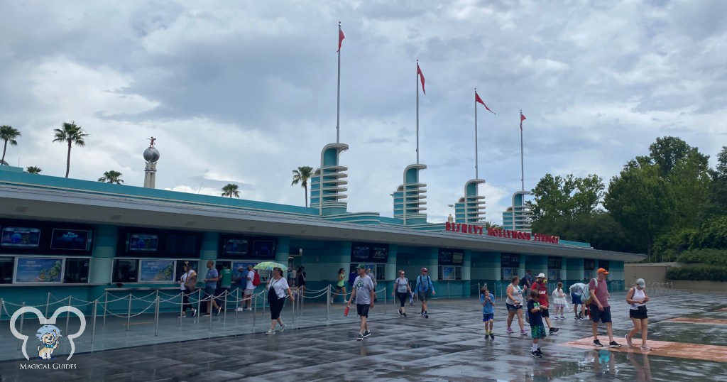 Rainy day at Disney's Hollywood Studios. You can see people without ponchos leaving the parks and guests carrying umbrellas. Don't get caught in the rain without being prepared!