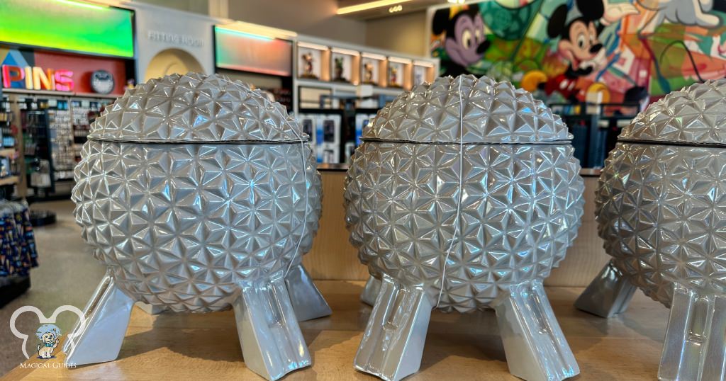 Several Spaceship Earth shaped cookie jars sitting on the shelf at the Creations Shop inside at EPCOT.