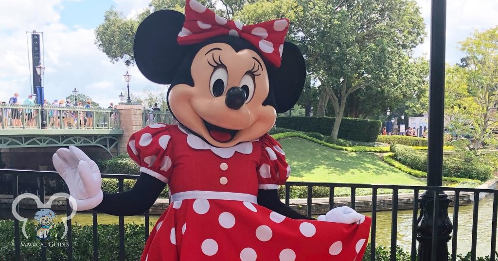 Minnie Mouse in her iconic polka dot dress right outside of the EPCOT Showcase