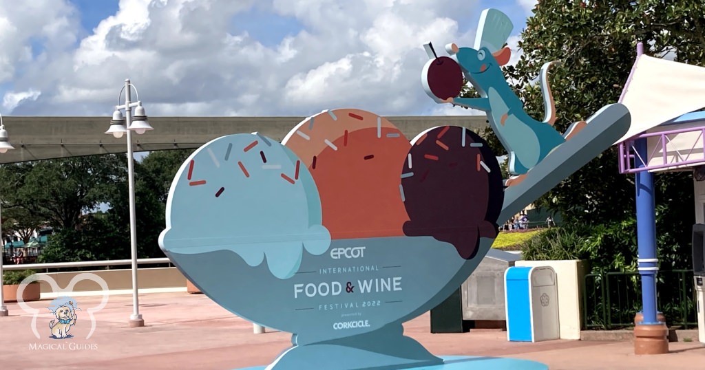 EPCOT Food & Wine Festival 2022 Sign before entering the World Showcase featuring Remy from Ratatouille. 