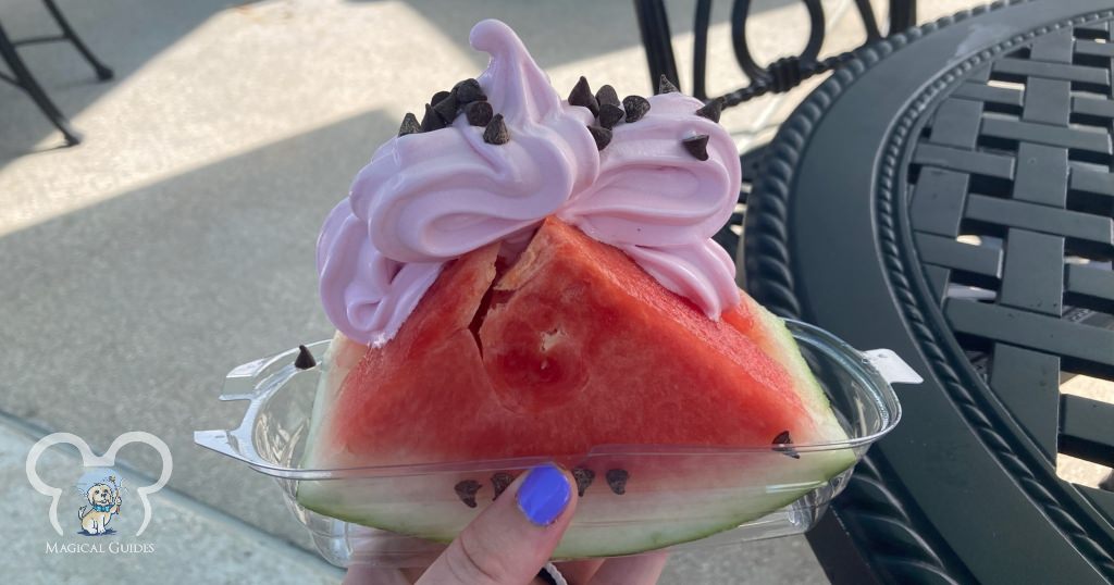 Watermelon Dole Whip® served in a watermelon slice at Swirls on the Water in Disney Springs.