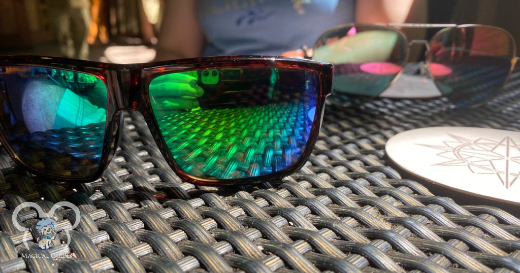 Sunglasses sitting on the table awaiting our cocktails at Animal Kingdom's Nomad Lounge before my husband lost his driver's license.