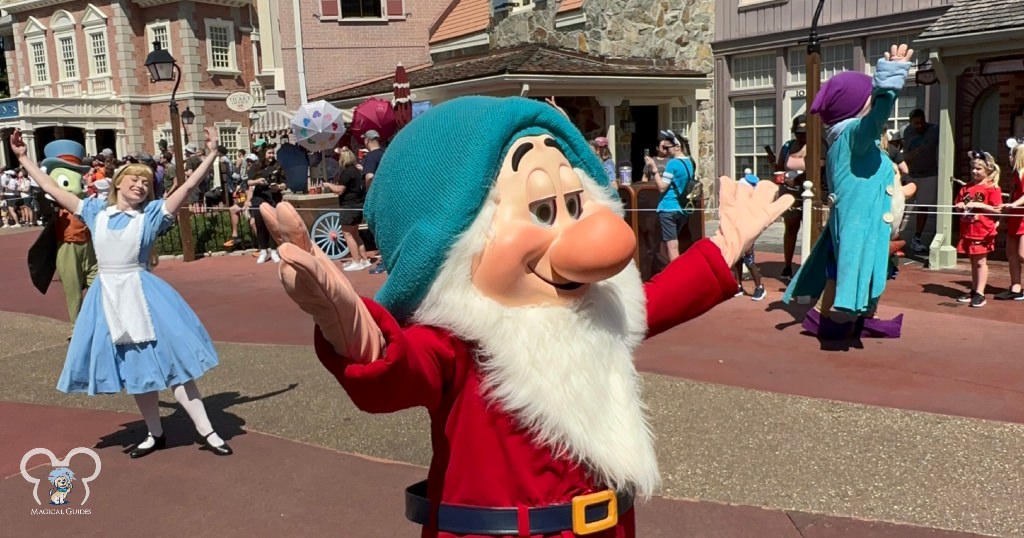 Snow White and the Seven Dwarfs, Alice in Wonderland, and Jiminy Cricket Dancing through the Festival of Fantasy Parade. These characters also interacted with guests along the way.