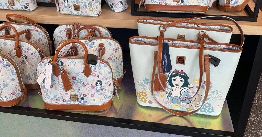 Snow White-themed merchandise and souvenirs in Disney World, the Dooney & Burke Purse we bought for my mom.