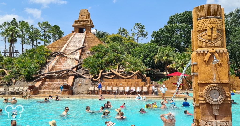 Relax at one of the largest pools at a Disney resort - the Mayan pyramid sends water down every so often.