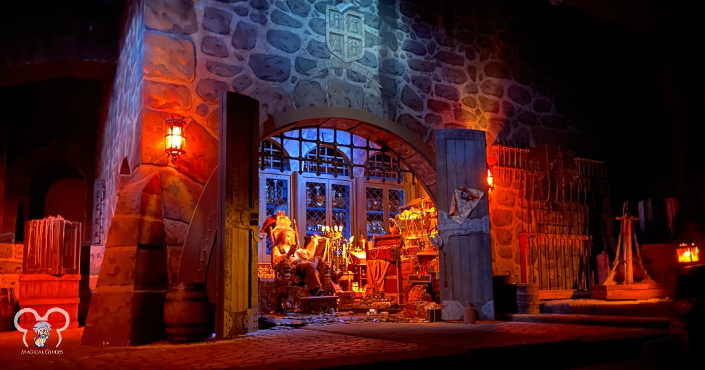 Captain Jack Sparrow sitting in his treasure room at the end of Pirates of the Caribbean ride inside Magic Kingdom.
