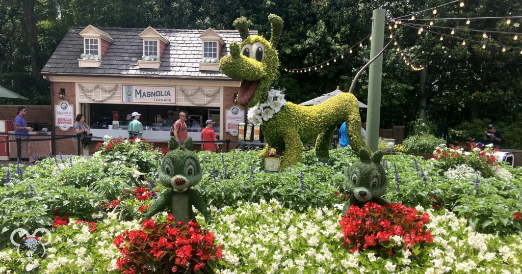 Magnolia Terrace at the America Pavilion during the EPCOT International Flower & Garden Festival. You can see the topiary for Pluto, Chip & Dale here.